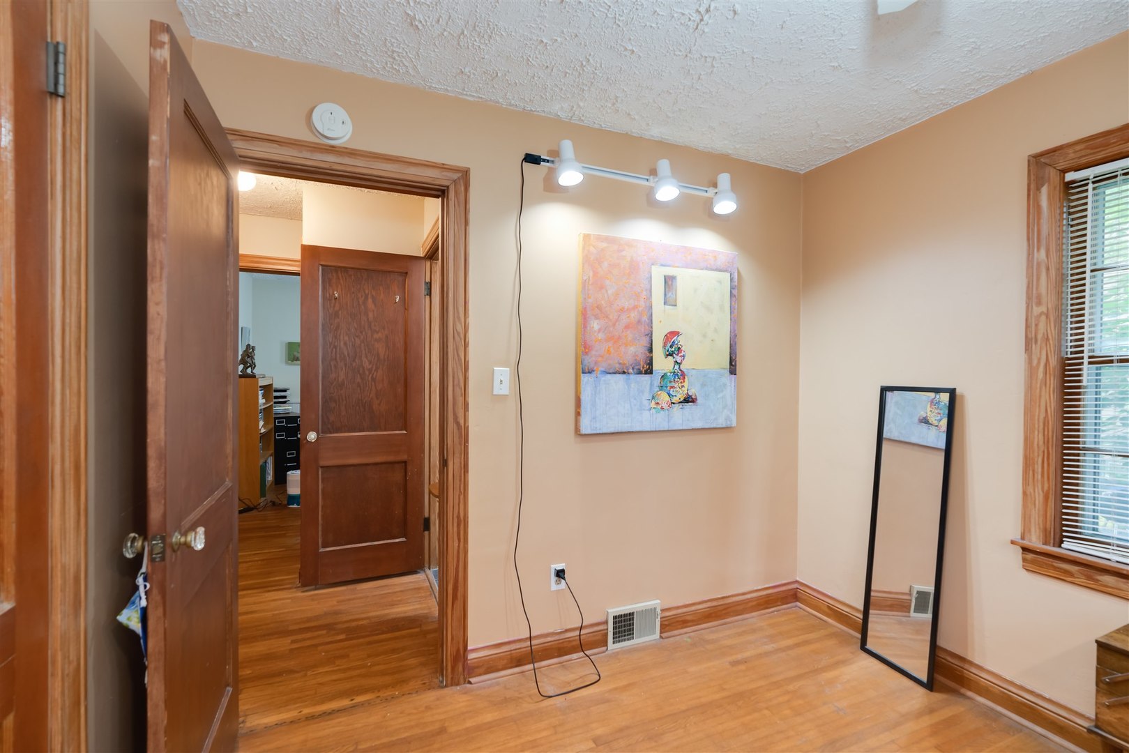 32 White Place Bloomington, IL 61701 - Photo 10 of 26 a view of a hallway with paintings on the wall