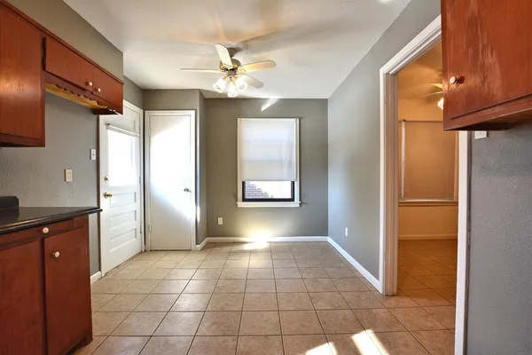 a view of a hallway to rooms