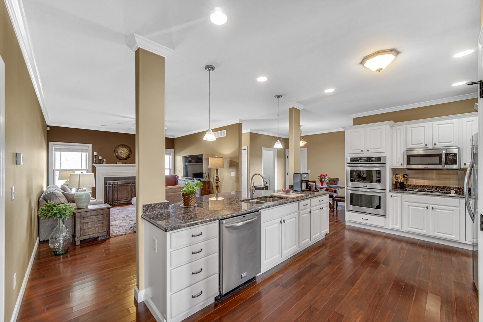 491 West Division Road Valparaiso, IN 46385 - Photo 11 of 38 a kitchen with stainless steel appliances kitchen island granite countertop a stove top oven a sink a dining table and chairs