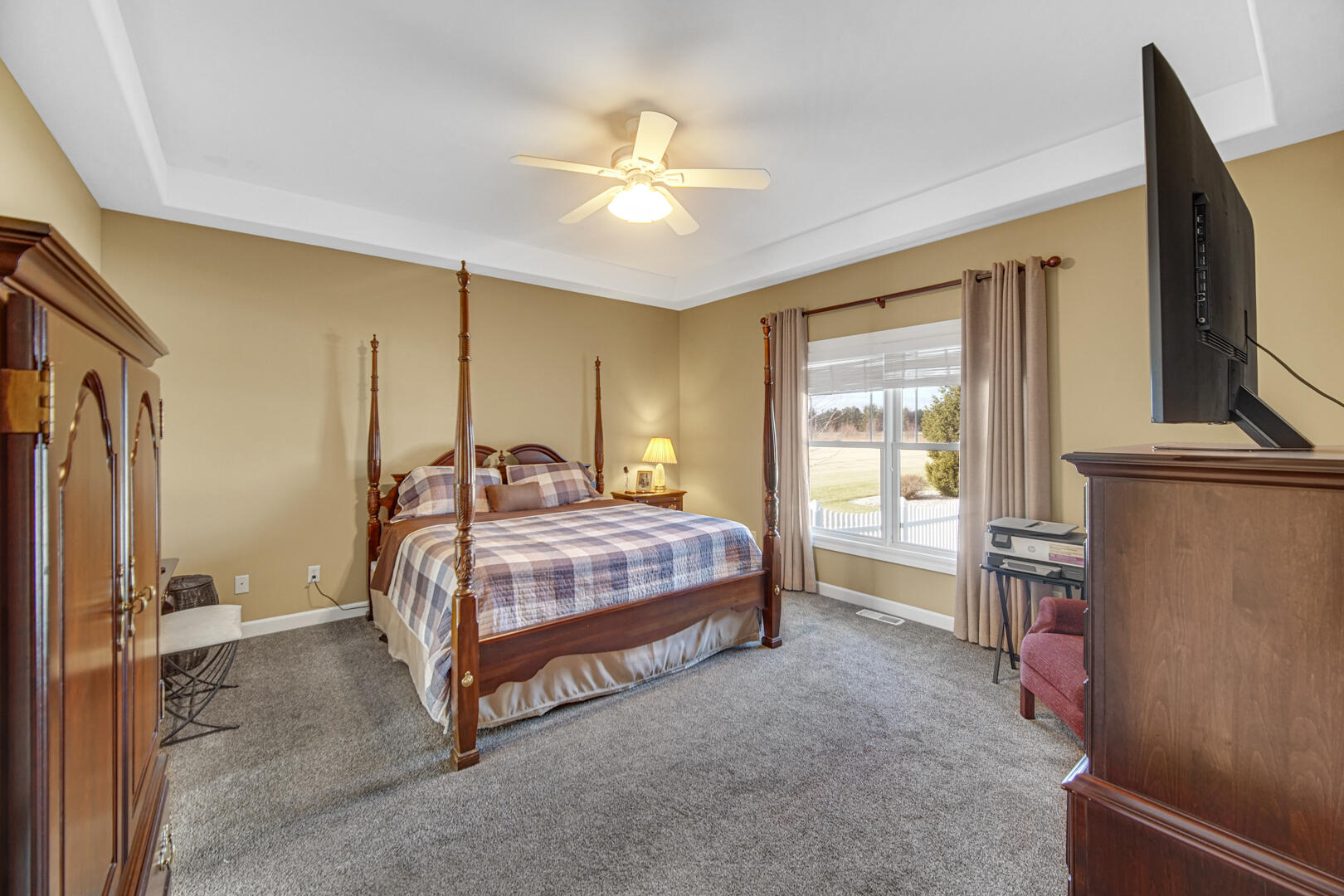 491 West Division Road Valparaiso, IN 46385 - Photo 21 of 38 a bedroom with a bed dresser and a flat tv screen