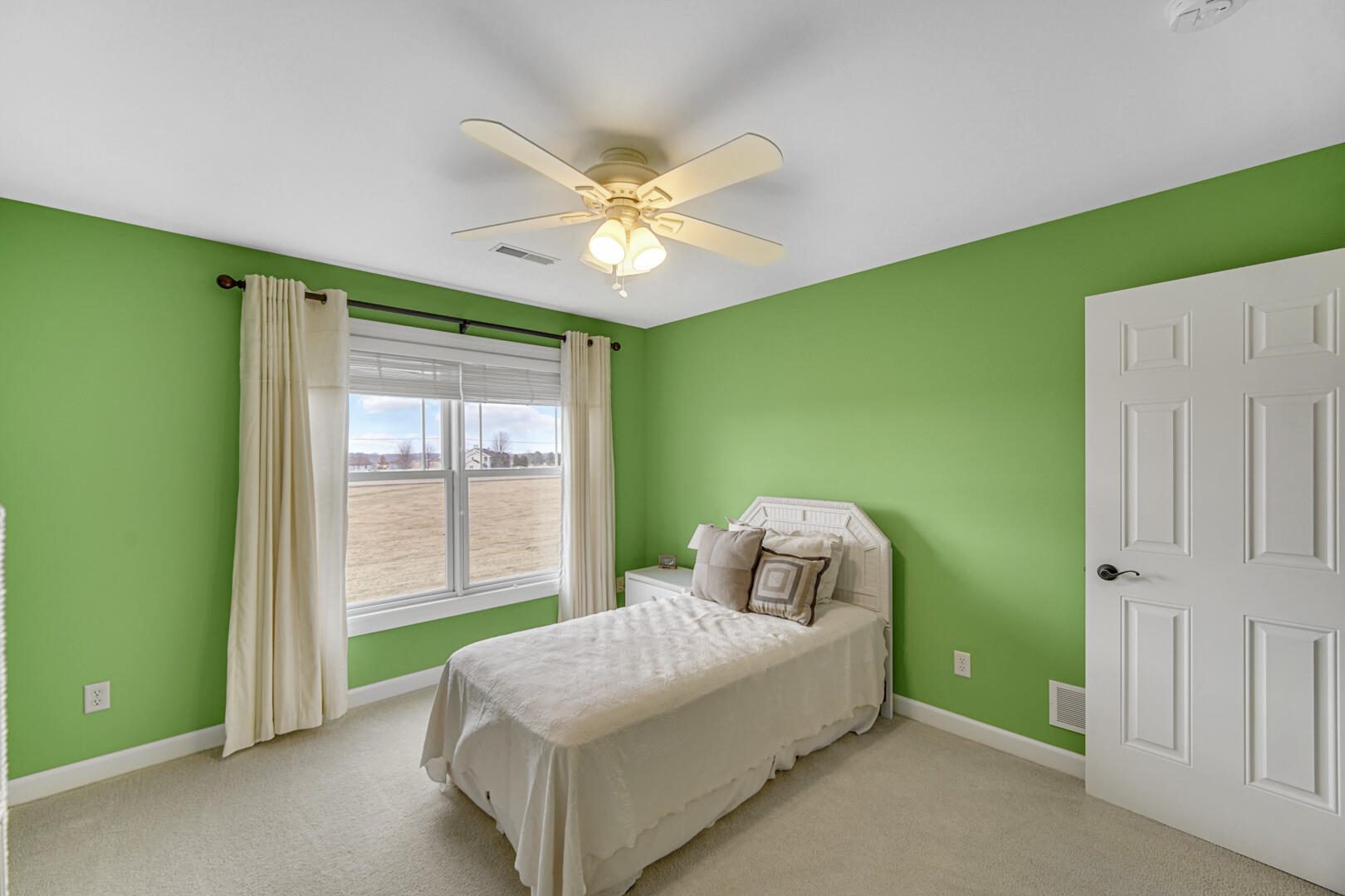 491 West Division Road Valparaiso, IN 46385 - Photo 26 of 38 a bedroom with a bed and a chandelier