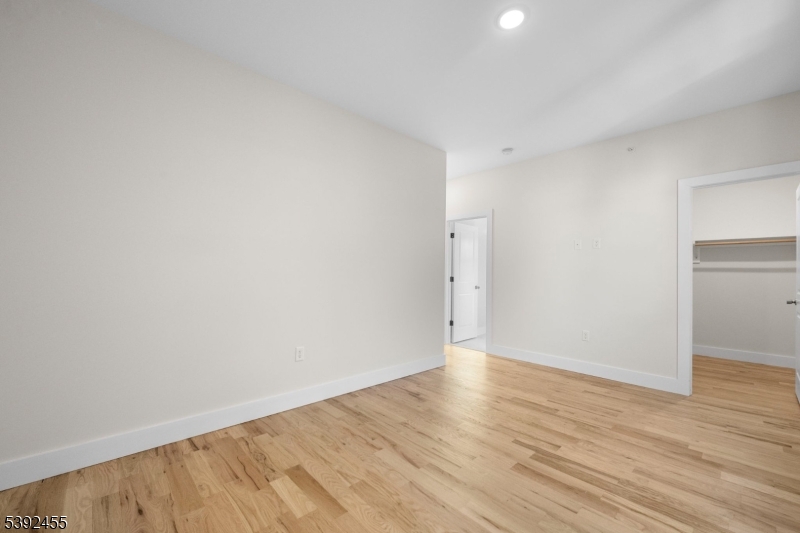 56 Second Street Elizabeth Port, NJ 07206 - Photo 16 of 28 a view of an empty room with wooden floor and closet