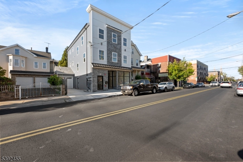 56 Second Street Elizabeth Port, NJ 07206 - Photo 2 of 28 a car parked on the side of a street