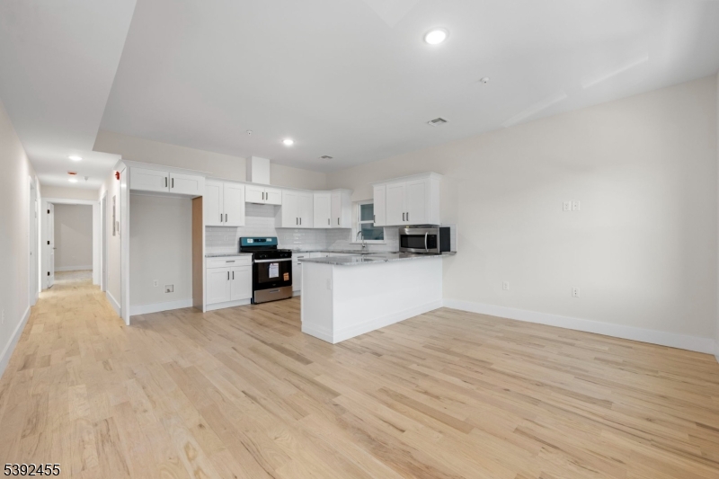 56 Second Street Elizabeth Port, NJ 07206 - Photo 25 of 28 a view of kitchen with wooden floor