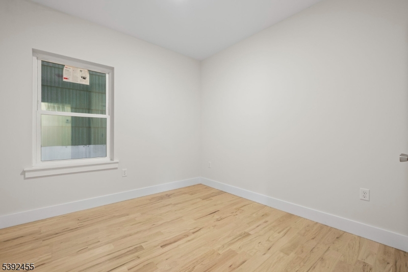 56 Second Street Elizabeth Port, NJ 07206 - Photo 3 of 28 an empty room with a window