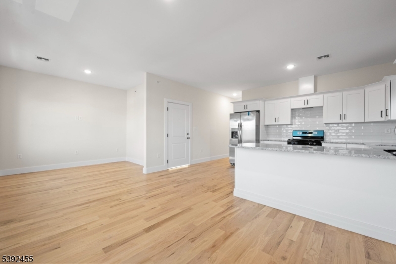 56 Second Street Elizabeth Port, NJ 07206 - Photo 9 of 28 a view of kitchen with wooden floor