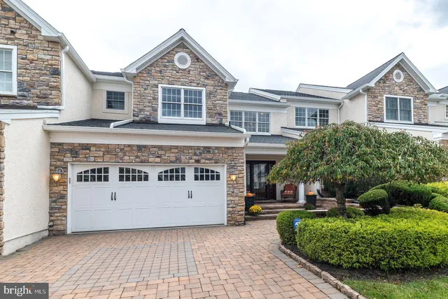 a living room with furniture a rug and a window