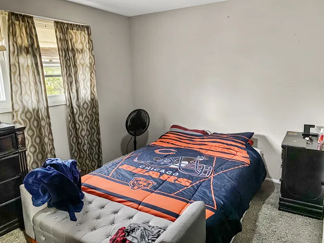 a bedroom with a bed and closet