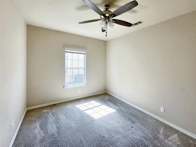 a bathroom with a granite countertop sink toilet and a mirror