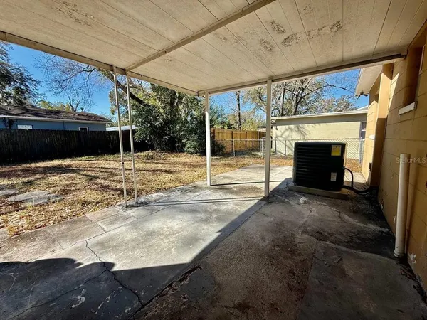 a view of a backyard of the house