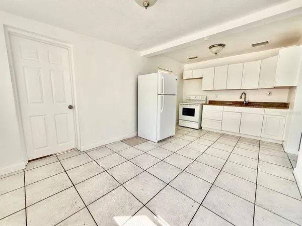 a kitchen with stainless steel appliances cabinets and a sink