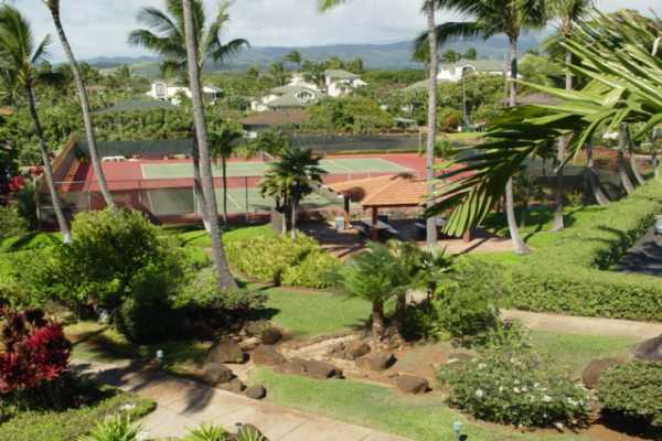 1870 Hoone Road, Unit 525 Koloa, HI 96756 - Photo 14 of 19 a backyard of a house with a yard and outdoor seating