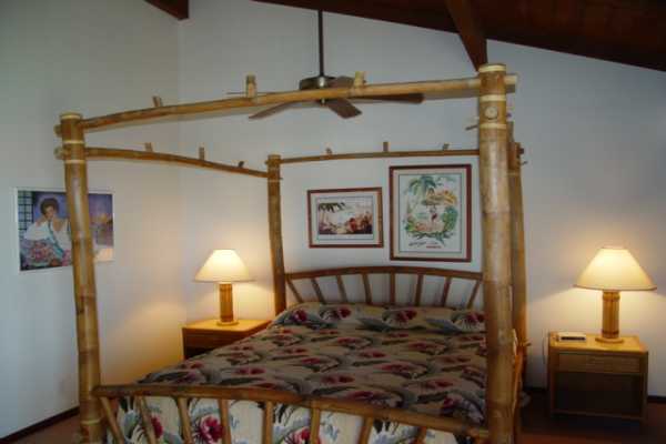 1870 Hoone Road, Unit 525 Koloa, HI 96756 - Photo 15 of 19 a bedroom with a bed and a lamp