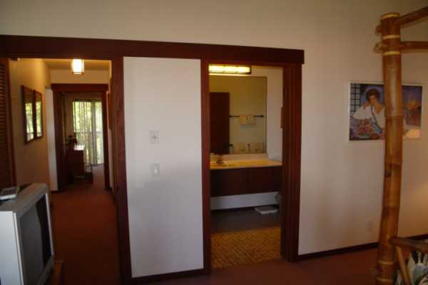 1870 Hoone Road, Unit 525 Koloa, HI 96756 - Photo 16 of 19 a view of hallway with a mirror