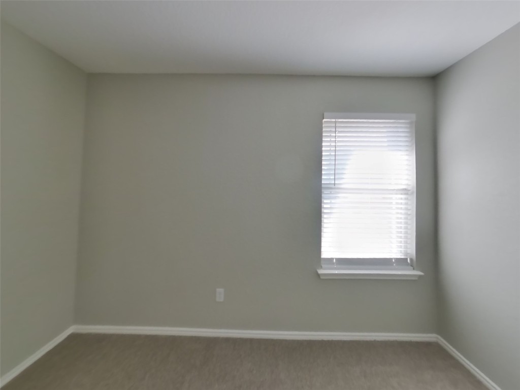 3106 Wickham Lane Austin, TX 78725 - Photo 11 of 16 an empty room with a window