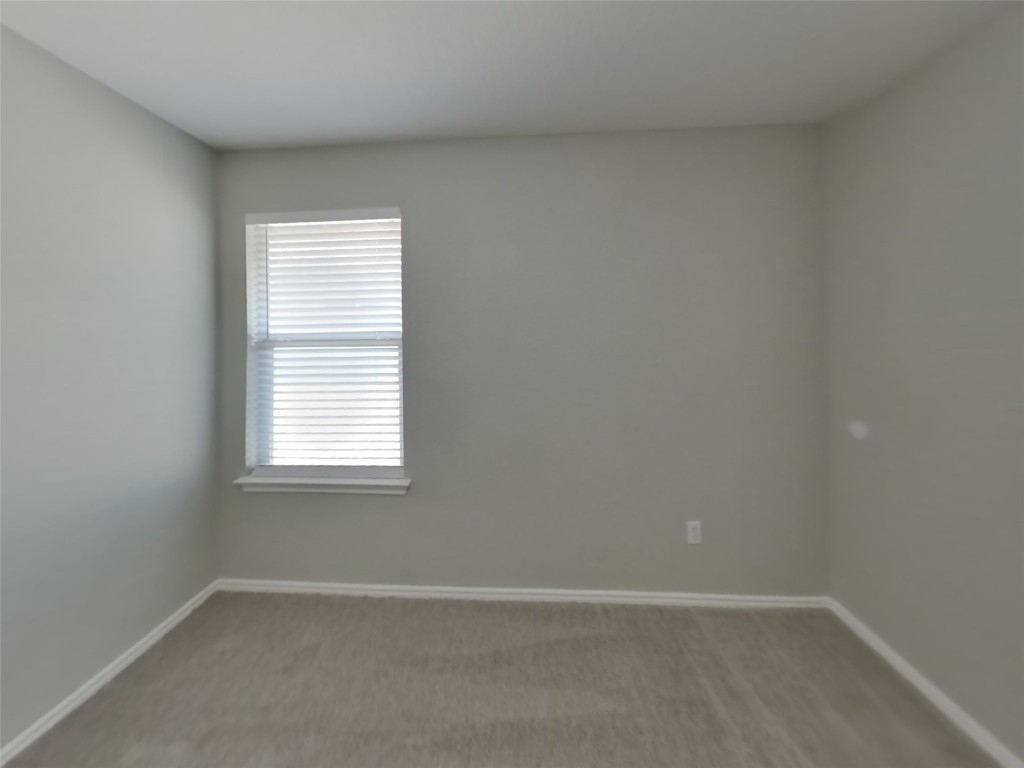 3106 Wickham Lane Austin, TX 78725 - Photo 12 of 16 an empty room with a window