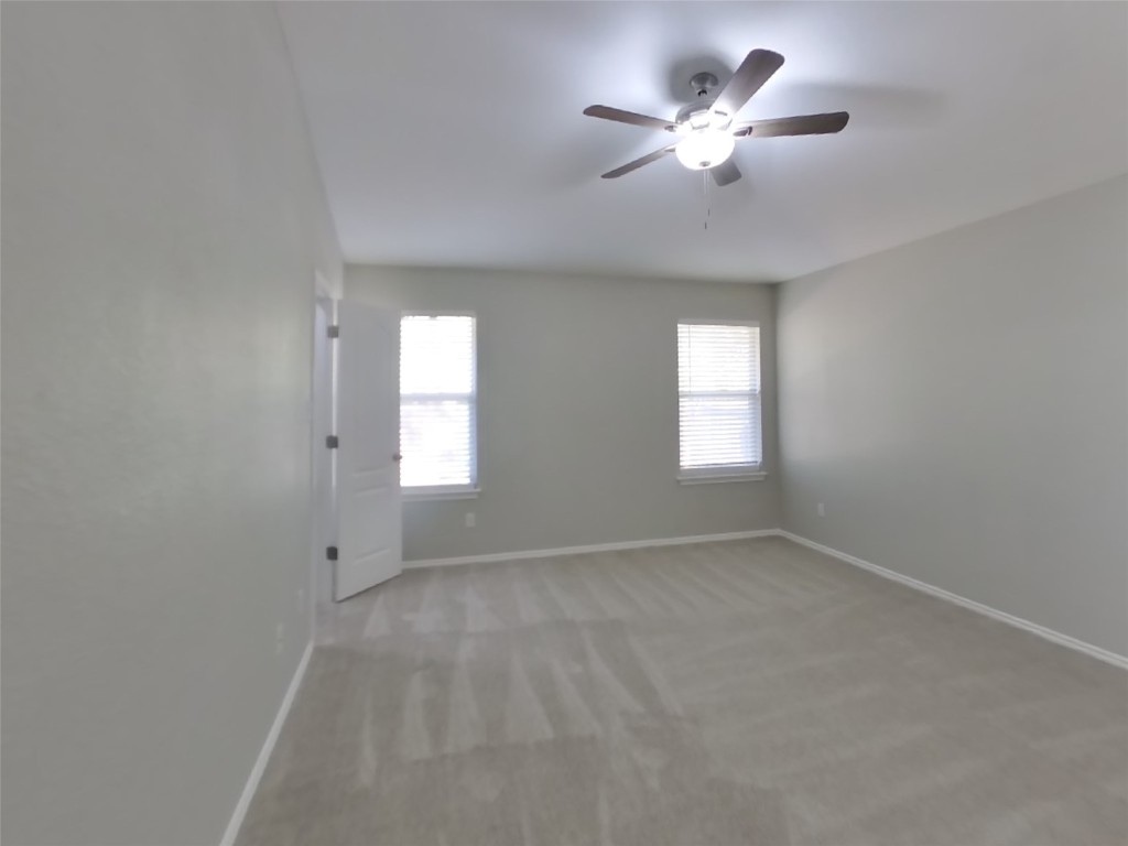 3106 Wickham Lane Austin, TX 78725 - Photo 7 of 16 a view of an empty room with a window