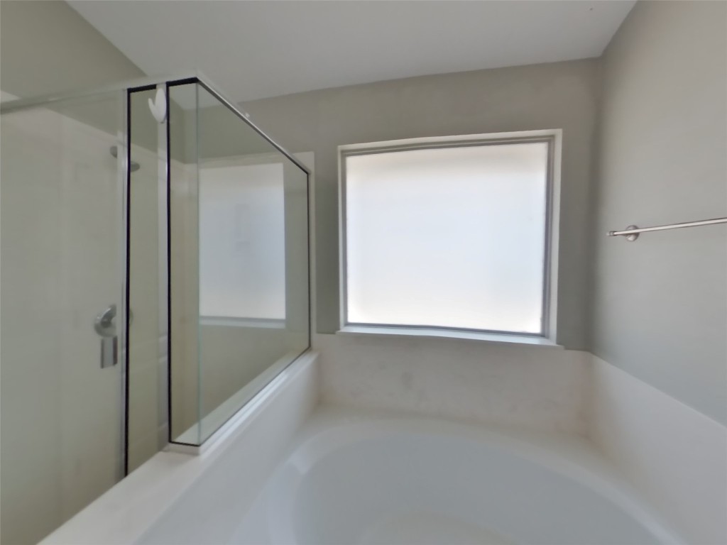 3106 Wickham Lane Austin, TX 78725 - Photo 10 of 16 a view of an empty room with a window