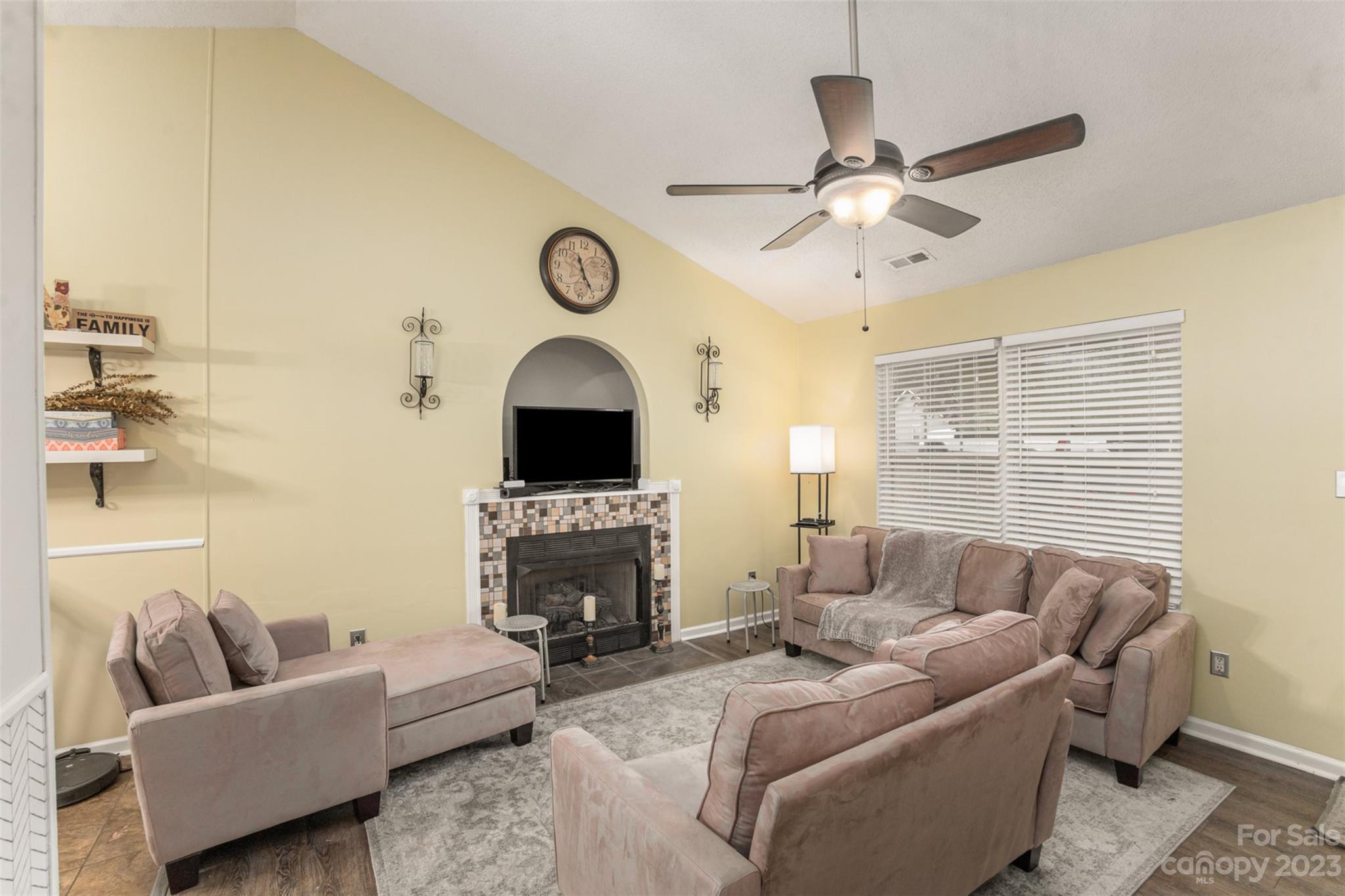 3144 Strong Gastonia, NC 28052 - Photo 11 of 26 a living room with furniture a fireplace and a window