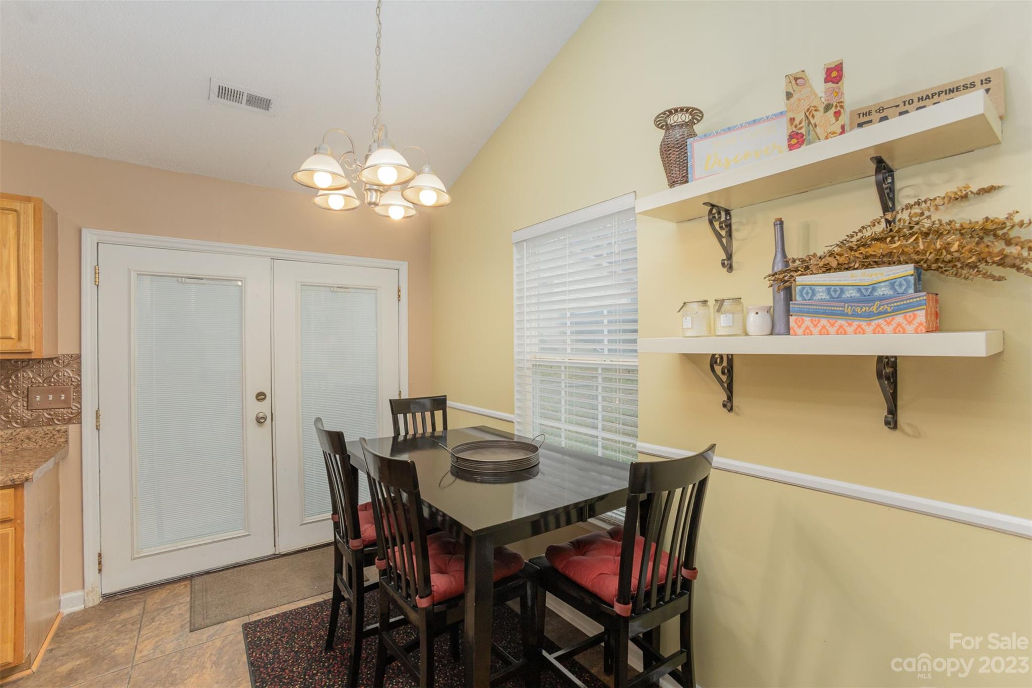 3144 Strong Gastonia, NC 28052 - Photo 14 of 26 a view of a dining room with furniture and chandelier