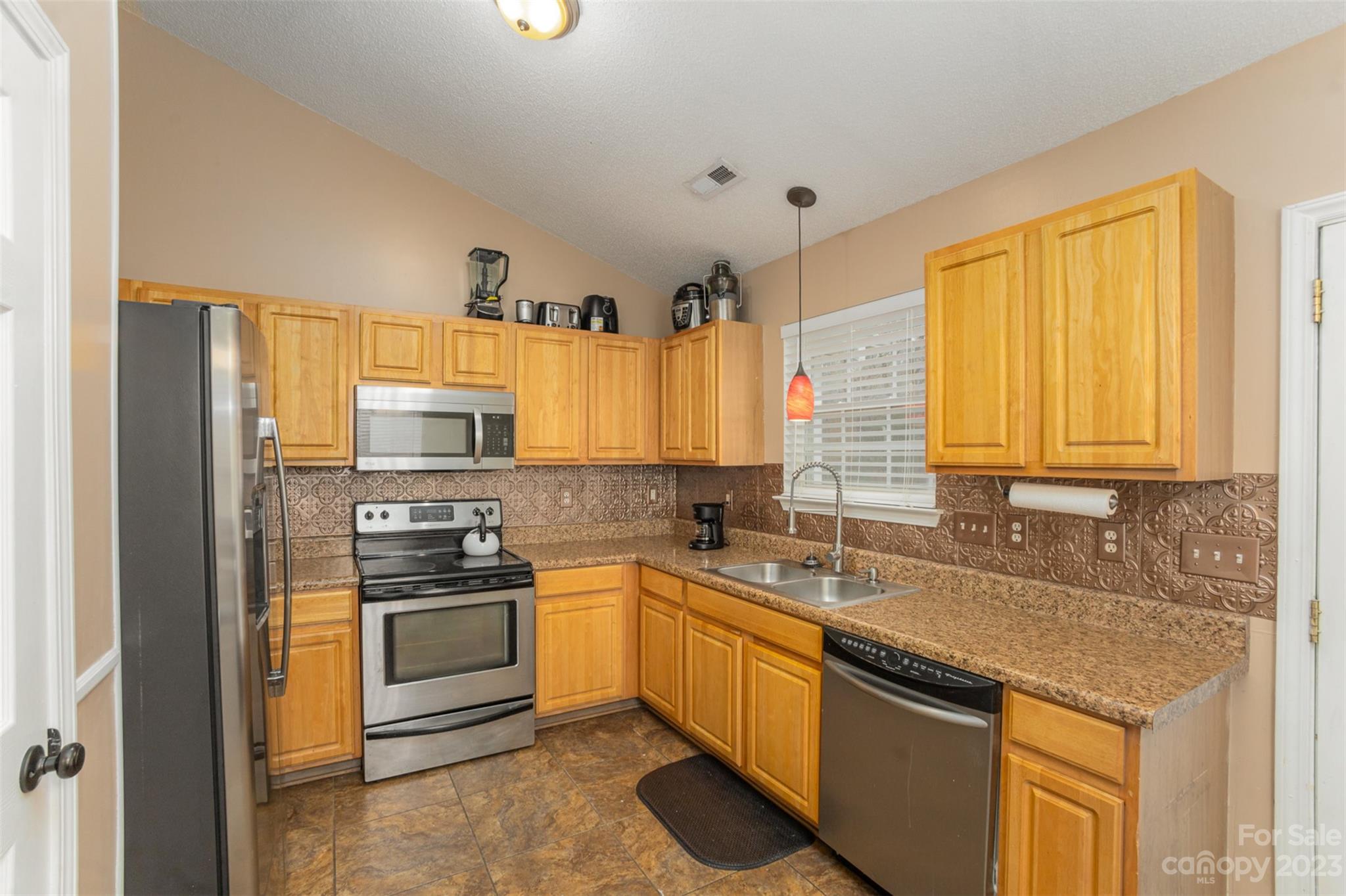 3144 Strong Gastonia, NC 28052 - Photo 17 of 26 a kitchen with a sink stove top oven and cabinets