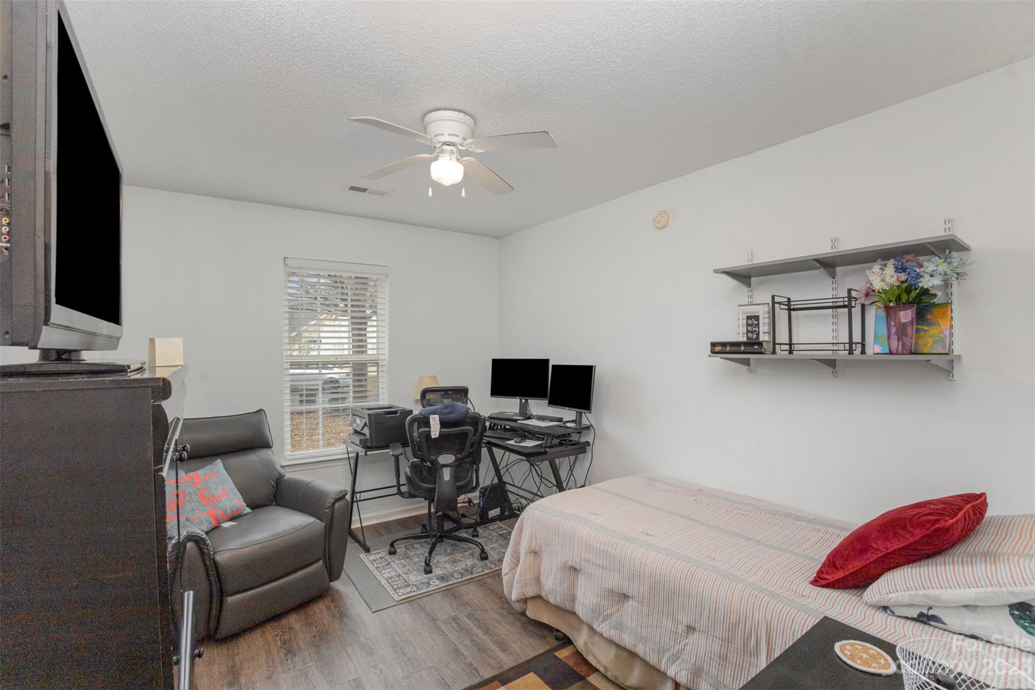 3144 Strong Gastonia, NC 28052 - Photo 19 of 26 a bedroom with furniture and a flat screen tv