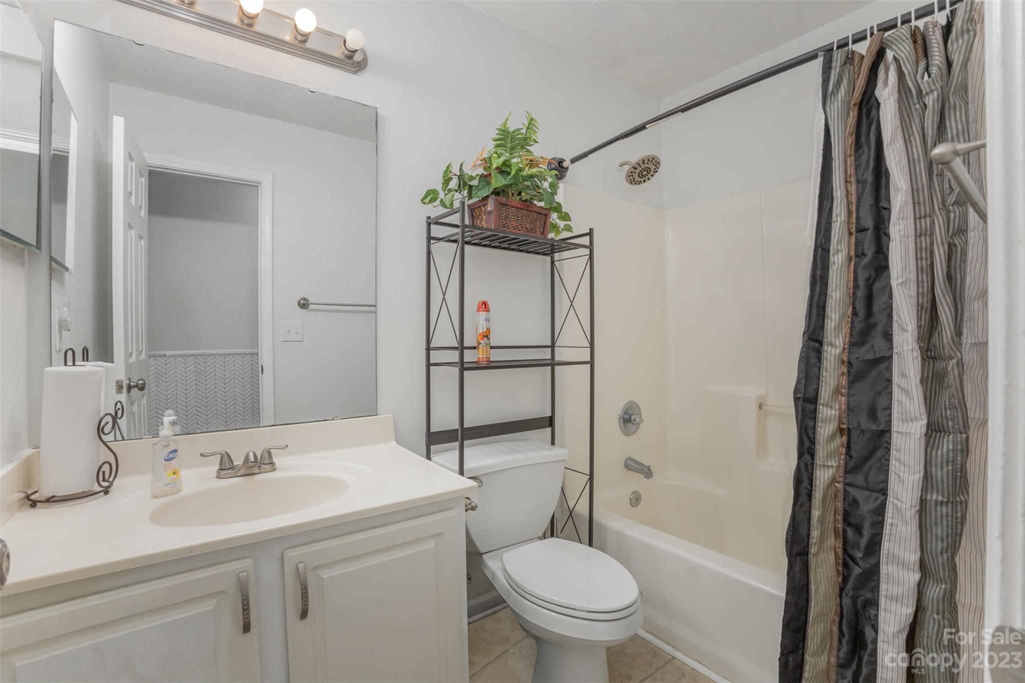 3144 Strong Gastonia, NC 28052 - Photo 20 of 26 a bathroom with a granite countertop sink toilet and shower