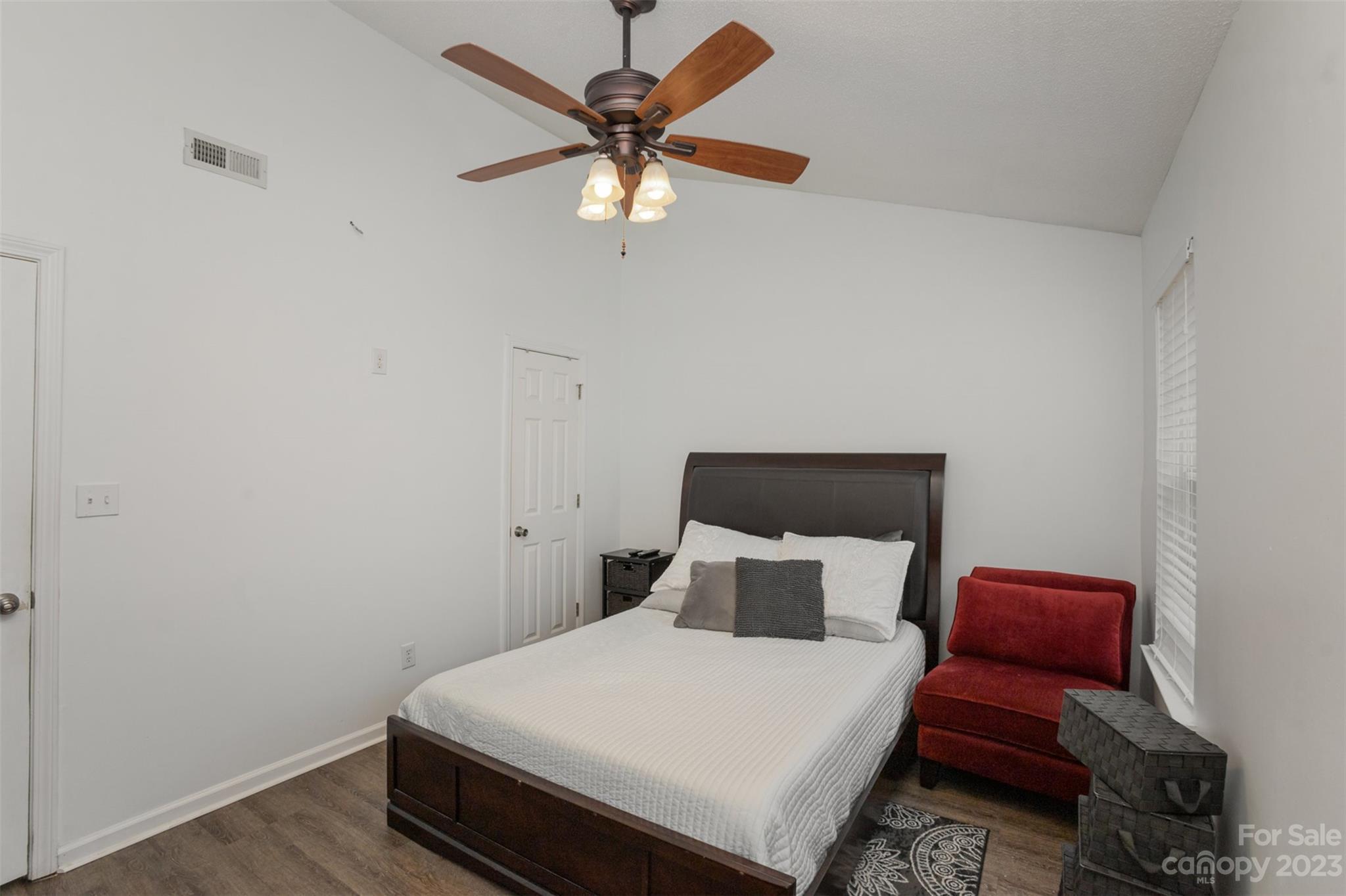3144 Strong Gastonia, NC 28052 - Photo 24 of 26 a bed sitting in a bedroom next to a window with a chandelier