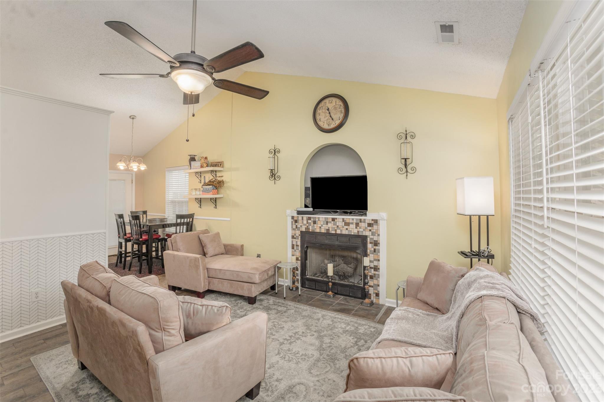 3144 Strong Gastonia, NC 28052 - Photo 9 of 26 a living room with furniture a fireplace and a large window