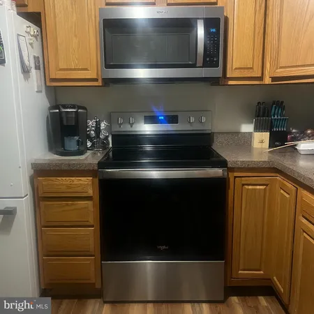 a kitchen with a sink cabinets and window
