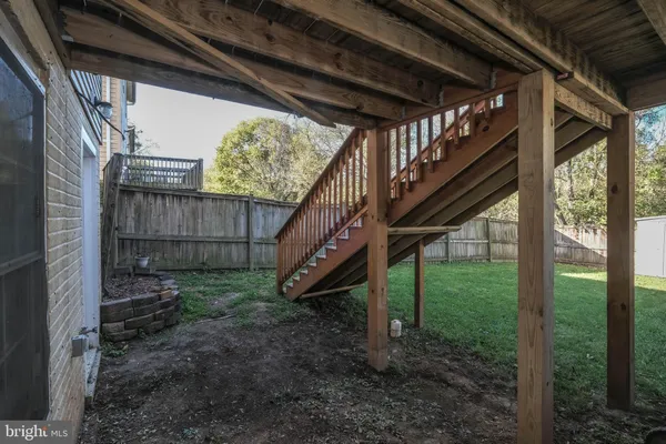 a view of an empty room with a window and a flat screen tv