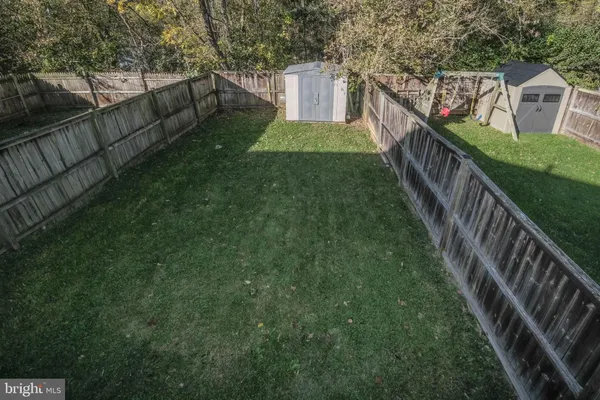a view of a house with backyard