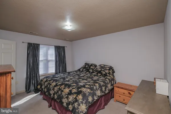 a view of balcony with wooden floor and fence