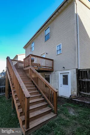 a view of a lake with a bench and a yard