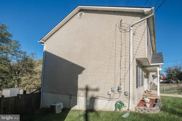a view of a street with cars parked on road