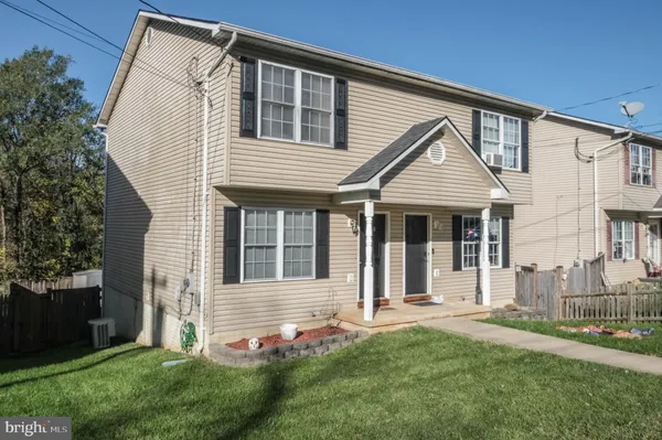 front view of a building with a garden