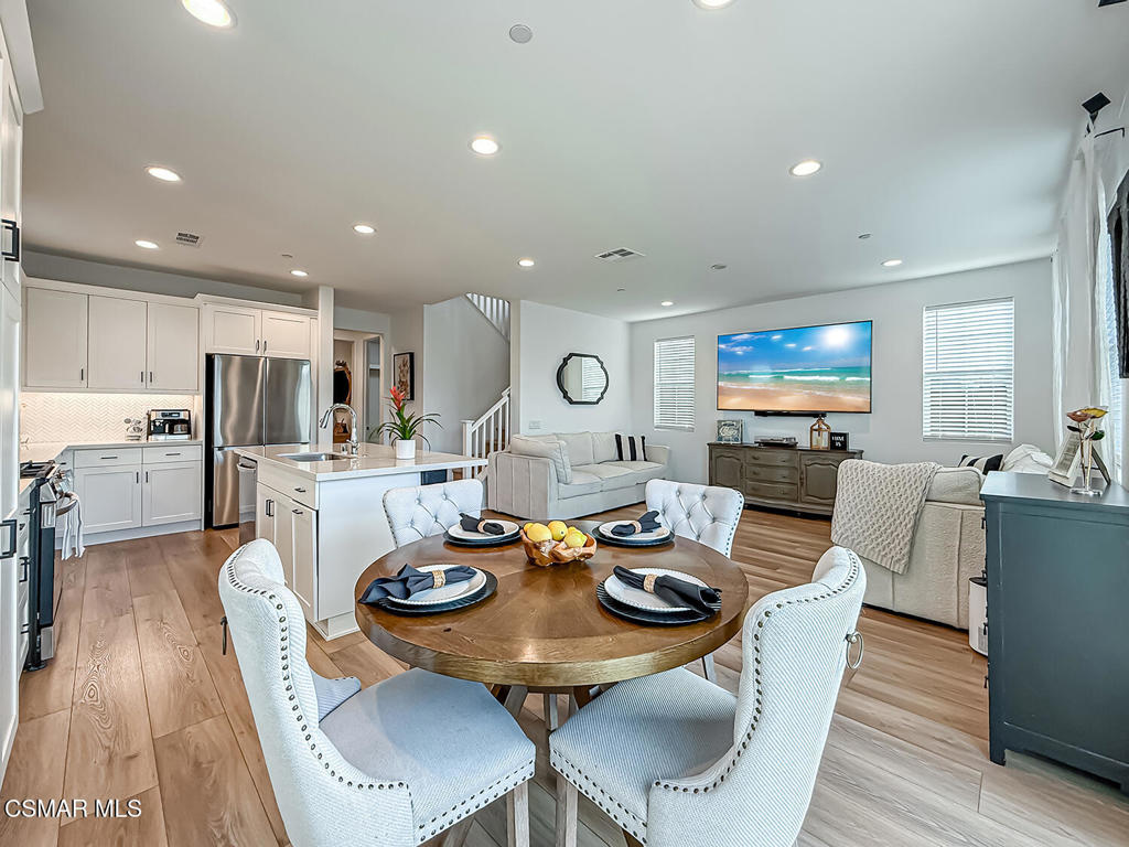 335 Fraser Camarillo, CA 93010 - Photo 18 of 75 a open dining room with furniture and wooden floor