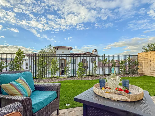 a bathroom with a double vanity sink mirror and shower