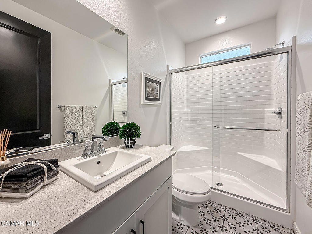 335 Fraser Camarillo, CA 93010 - Photo 31 of 75 a bathroom with a sink toilet a mirror and shower