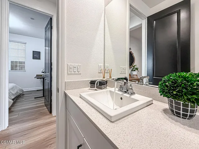 a bathroom with a shower curtain and a sink