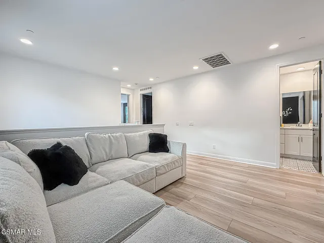 a bathroom with a tub sink and a mirror