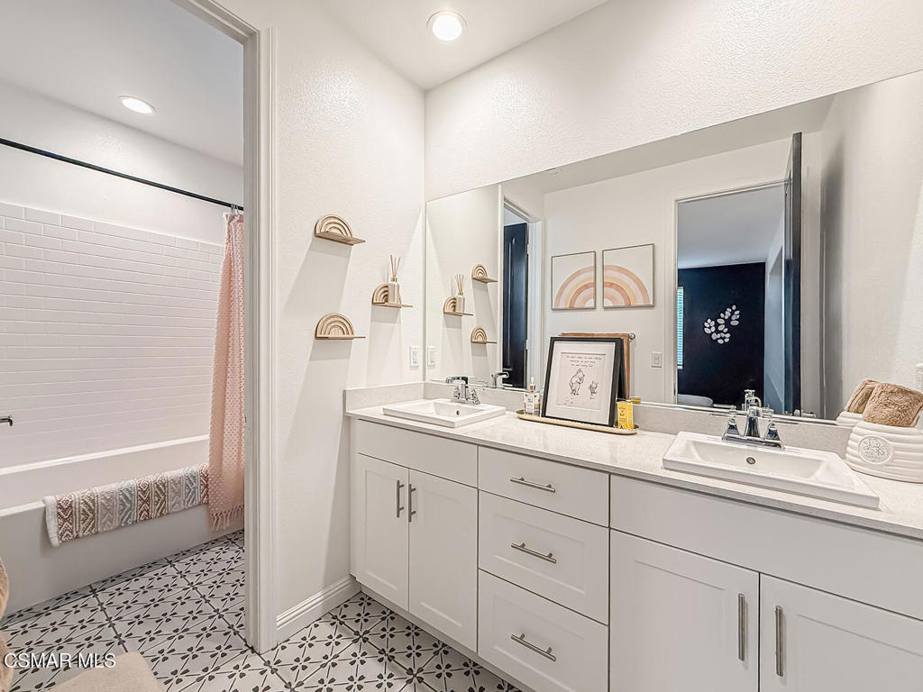 335 Fraser Camarillo, CA 93010 - Photo 46 of 75 a bathroom with a double vanity sink mirror and shower