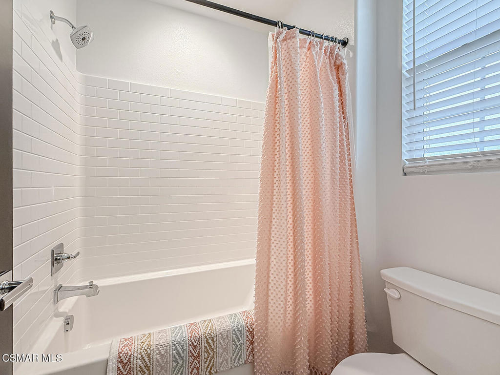 335 Fraser Camarillo, CA 93010 - Photo 48 of 75 a bathroom with a shower curtain and a sink