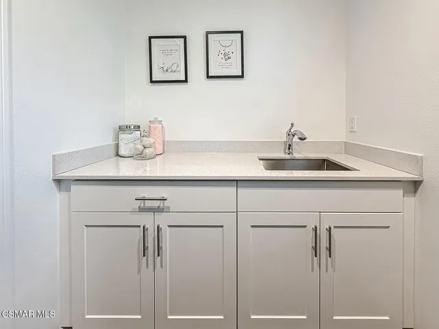 a view of a room with gym equipment and a large window