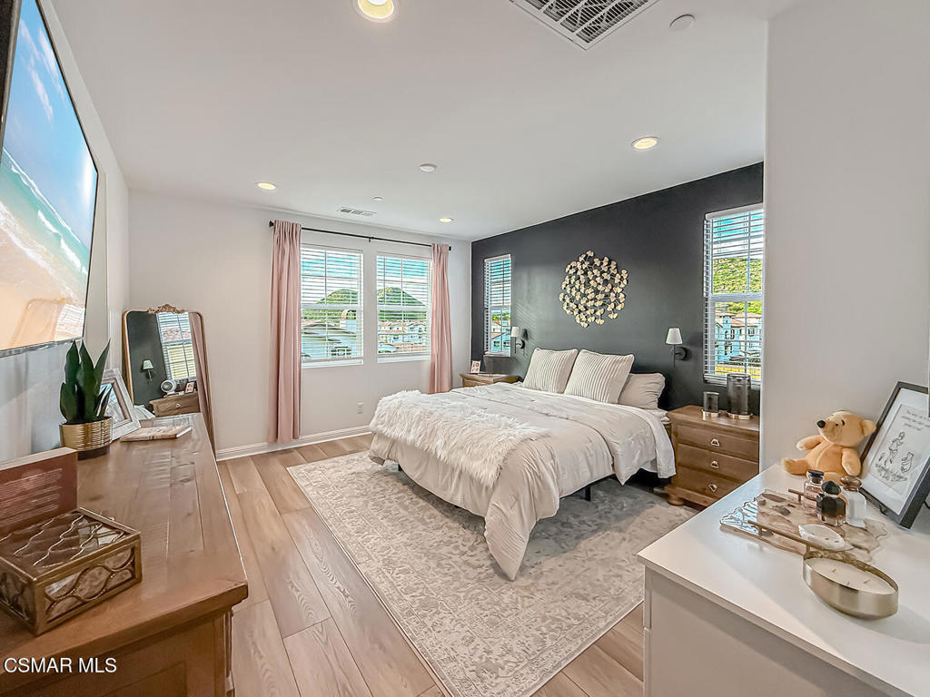335 Fraser Camarillo, CA 93010 - Photo 53 of 75 a bedroom with a bed and wooden floor