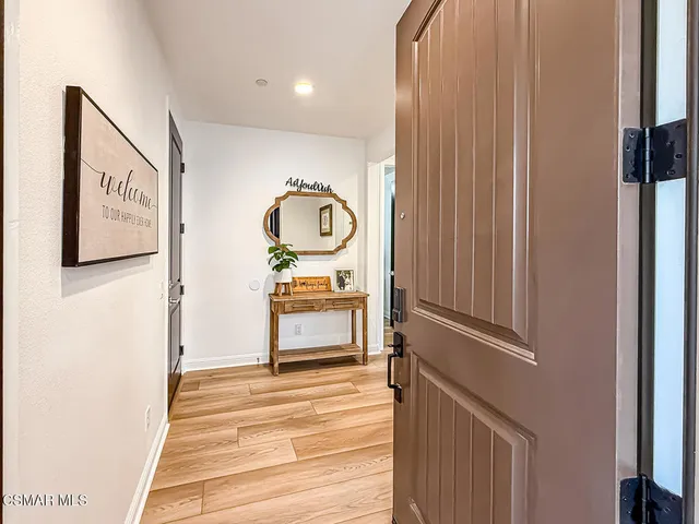 a open dining room with furniture and wooden floor