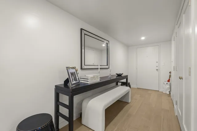 a bedroom with a bed and a table