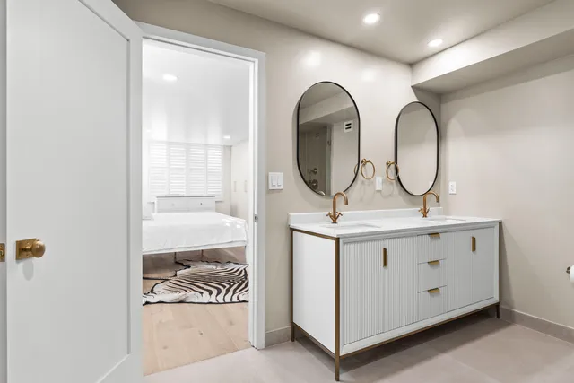 a bathroom with a sink a mirror and a shower