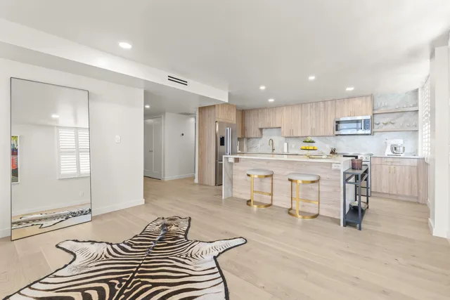 a kitchen with a table and chairs in it