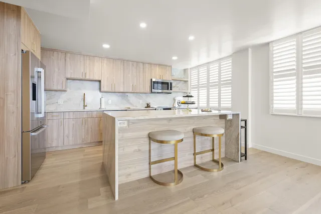 a kitchen with a sink cabinets and window